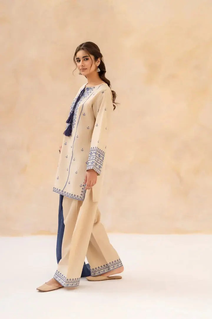 Side view of Sundari embroidered shirt with trouser and chiffon dupatta by Shai Noor.