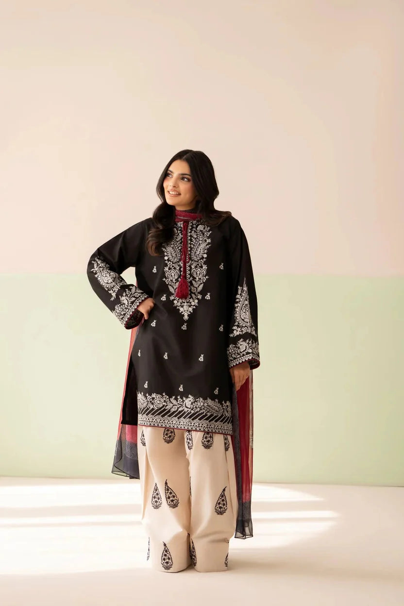 Shai Noor Gul e Siyah 3-piece embroidered lawn suit for women, featuring intricate embroidery on black fabric with matching dupatta and trousers.